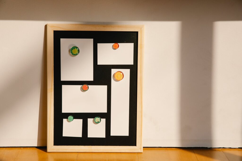 framed board with blank stickers placed on floor